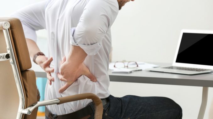 man suffering from back pain