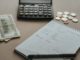 paper cash and calculator on a table