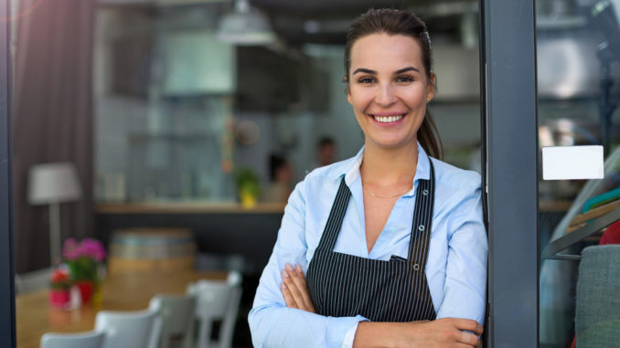 woman server in front of restaurant