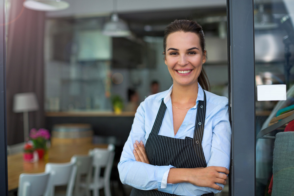 woman server in front of restaurant