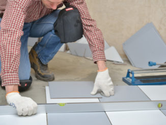 man installing tiles